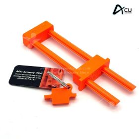 Close-up image of the ACU Lok bow lock installed through a compound bow cam. The safety orange molded ABS construction is clearly visible, emphasizing durability and high visibility. The lock secures the bow at the limbs, preventing draw and release. The 